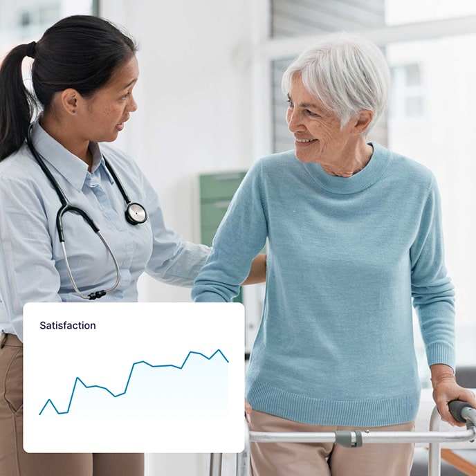 A young female doctor talks to a satisfied patient using a walker.